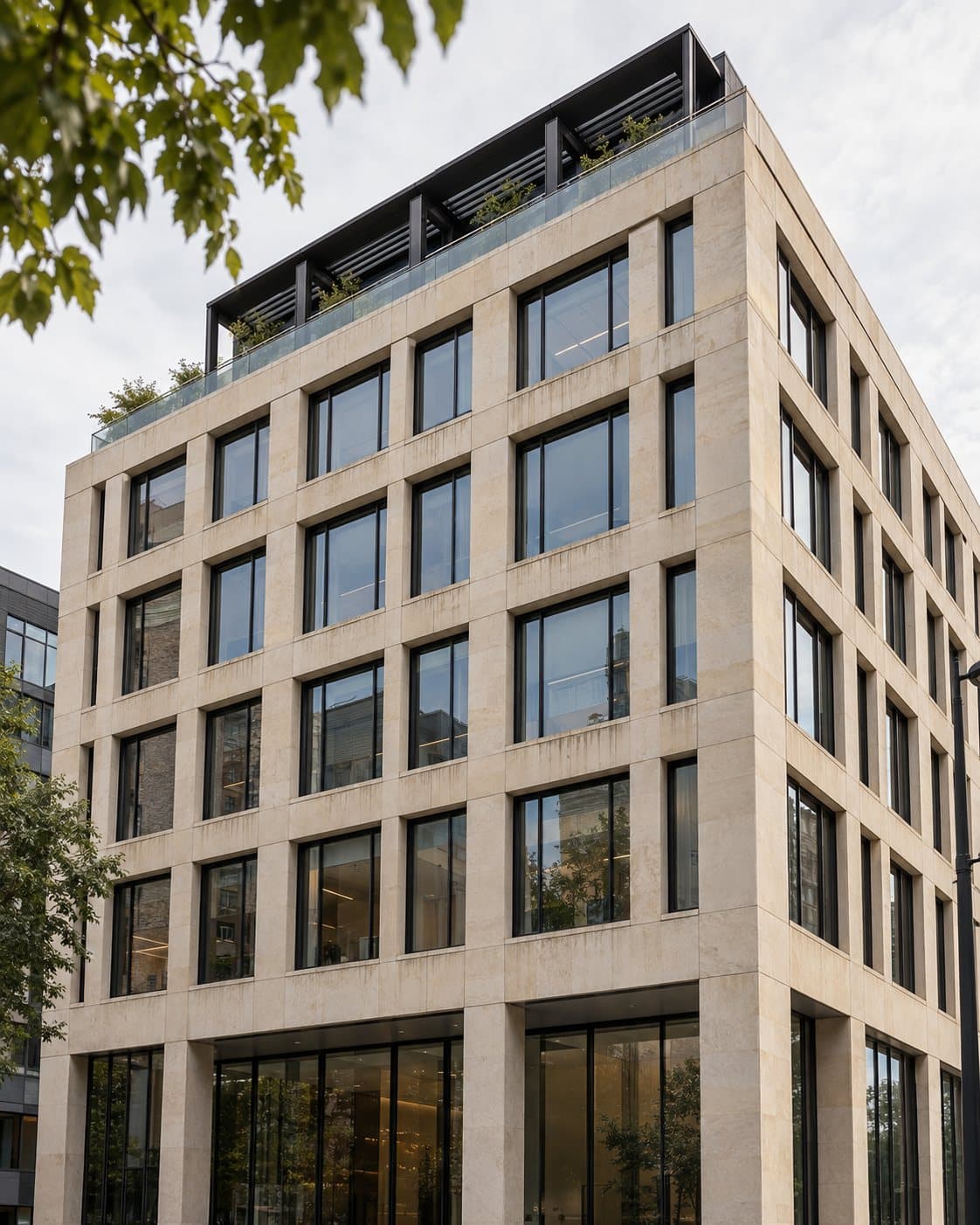 A six-story stone office building with tall black-framed windows